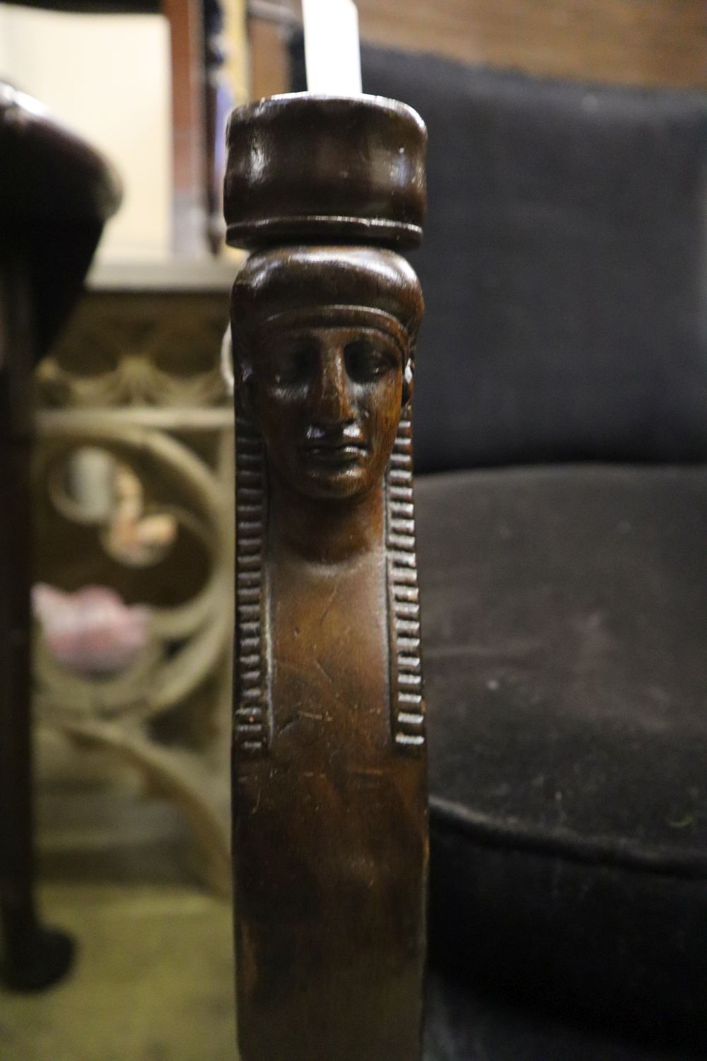 A French Empire mahogany fauteuil with lions paw feet